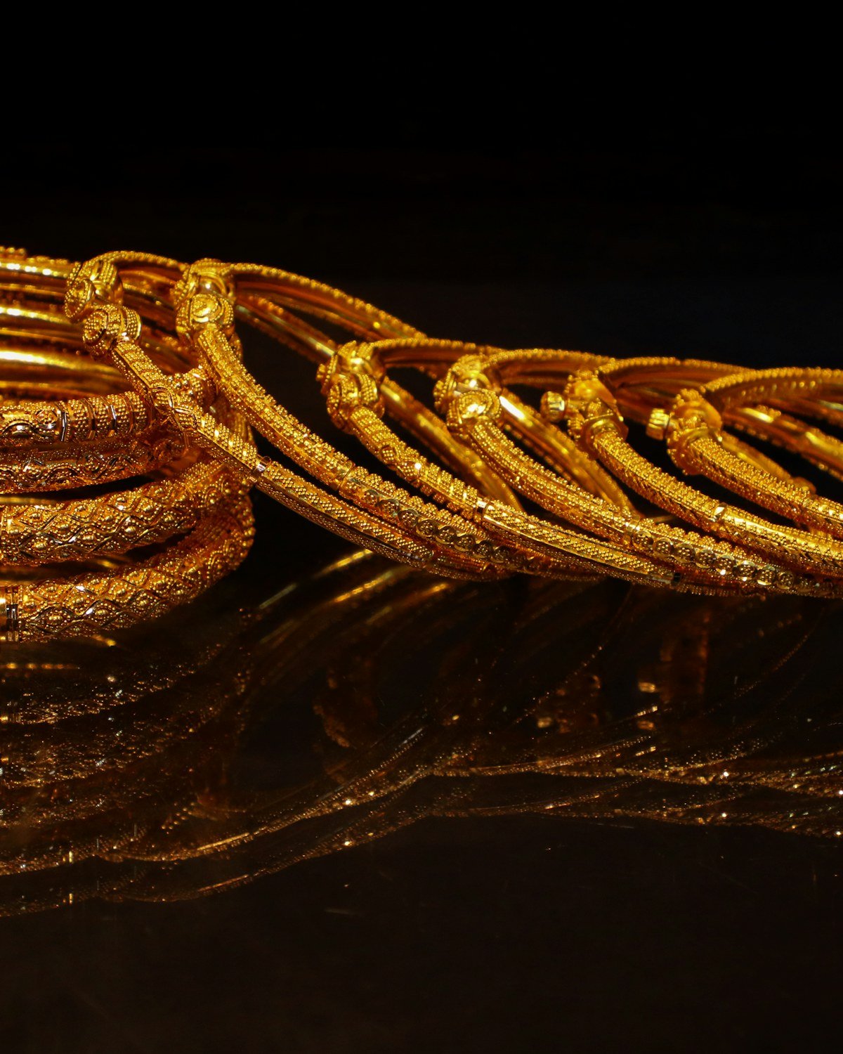 Stack of ornate gold bangles